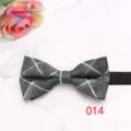 Close-up detail of the gray plaid men bow tie showing fine fabric texture and neat stitching. - Color 014