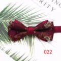 Detailed shot of wine red double layer men bow tie with gold floral jacquard pattern. - Color 022