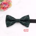 Detailed view of dark green plaid men bowtie with neat texture and fine checkered pattern. - Color 022