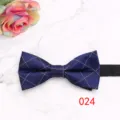 Detailed view of a stylish blue geometric patterned men's bow tie for formal business wear. - Color 024