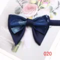 Detailed view of a stylish navy blue double-layer bow tie with elegant floral pattern. - Color 020