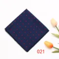 Close-up detail of navy blue pocket square featuring red geometric patterns and tulips. - Color 021