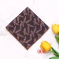 Men's polyester pocket square detail shot with geometric feather pattern on marble background. - Color 006