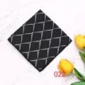 Black polyester pocket square with a stylish silver diamond grid pattern for men. - Color 022