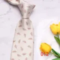 Close-up detail of light men's tie with brown leaf print, elegant business casual style. - Brown Feather Floral (012)