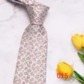 Detail shot of classic patterned men's tie with elegant paisley design and refined texture. - Paisley Floral (015)