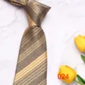 Close-up detail of the classic striped mens necktie with textured pattern, elegant business style. - Brown Gold Stripe (024)