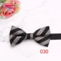 Close-up detail of the classic black and grey striped men's bow tie on marble surface. - Style 030