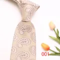 Detailed close-up of a classic beige paisley silk tie texture and elegant pattern design. - 001 (Beige Paisley)