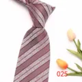 Detail view of men's classic striped polyester tie, showing fine woven fabric texture. - 025 (Burgundy Striped)