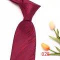 Detailed view of classic burgundy striped men's necktie made from premium polyester silk. - 028 (Burgundy Striped)