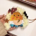 Handmade cute bean pod doll pendant close up detail showcasing fluffy hair and checkered apron - Pea Pod Doll 6