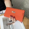 Oranger Leder Geldbörsen Clutch, klassisches Drehverschluss Design, elegante Handytasche. - Orange