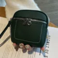 Kompakte dunkelgrüne Mini-Brieftasche aus echtem Leder, kleines Portemonnaie mit Reißverschluss. - Grün
