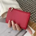 Red genuine leather mini three-fold wallet with coin pocket, compact and stylish daily accessory. - Red