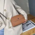 Brown cowhide leather women shoulder crossbody bag, elegant flap design with gold hardware. - Earthy Yellow