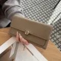 Women genuine leather long wallet luxury designer style clutch purse with floral metal clasp. - Gray
