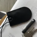 Minimalist genuine leather neck key pouch, chic black pull-type mini key holder charm. - Black