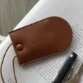 Minimalist cowhide neck-hanging key pouch in brown, chic mini leather key holder variant. - Brown