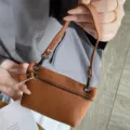 Mini brown pebble leather coin purse handbag with handle and zipper closure for women - Earthy Yellow