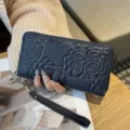 Camellia embossed leather long wallet with single zipper and wrist strap variant style. - Sapphire Blue