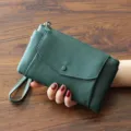 Dark green leather clutch wallet for women, stylish wristlet purse with zipper closing. - Dark Green