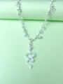 Silver rhinestone snake anklet variant featuring delicate bow charms for summer beach wear. - Silver