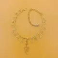 Exquisite rhinestone bow and snake pendant gold anklet, sparkling fashion jewelry detail. - Gold