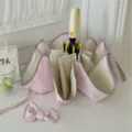 Parapluie rose et beige avec joli nœud pour les journées ensoleillées et pluvieuses. - Rose