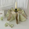 Parapluie pliant bicolore élégant avec des bords arrondis et un joli nœud papillon assorti. - Vert matcha