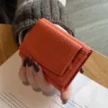 Kompaktes Leder Dreifach-Geldbörse für Damen, orangefarbene kleine Münztasche Portemonnaie. - Orange