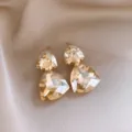 Détail de pendentif triangle en cristal exquis, pierres facettées scintillantes au style chic. - Boucles d'oreilles pendantes triangle double couche (4#) / Champagne