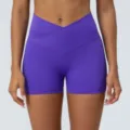 Purple high-waisted crossover yoga shorts, stretch fitness gym activewear with butt lift. - Purple