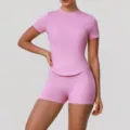 Pink short sleeve athletic top and matching yoga shorts activewear set for women fitness. - XL / Top And Bottom / Pink