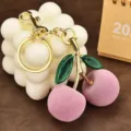 Cute pink flocked cherry keychain bag charm with gold metal clasp and glitter leaves - Flocked Double Leaf Cherry / Pink