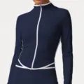 Women's long sleeve zip-up athletic jacket in navy blue with white contrast piping details. - Navy Blue