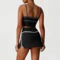 Stylish black two piece athletic crop top and skirt set with elegant white piping details. - S / Top And Bottom / Black
