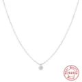 Macro view of minimalist 925 sterling silver necklace with sparkling round diamond pendant - Single Stone Style / Gold