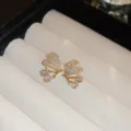 Close-up of sparkling zircon butterfly stud earrings, detailed view of gold-plated metal texture. - 22# Silver Earring Post - Gold (Real Gold Plated)