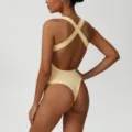 Tuta intera da yoga a costine con incrocio sulla schiena da donna, abbigliamento sportivo. - Taglia S / Albicocca