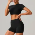 Black athletic yoga set featuring a crop top and high-waisted shorts for fitness workouts. - S / Top And Bottom / Black