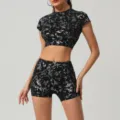 Stylish women foil print activewear set featuring short sleeve crop top and matching shorts. - M / Set / Premium Black