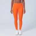 Leggings de yoga orange vif taille haute, pantalon de fitness elastique pour femmes. - S / Orange