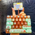 Lindo llavero de juguete con teclado mecánico de 26 teclas y colgante para bolso antiestrés. - Serie Estación de recarga de estado de ánimo [A - gatito marrón]