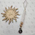 Silicone pacifier clip detail view featuring white beads and wood accents for baby daily use. - Off-White Abacus Beads