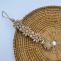 Silicone daisy flower pacifier clip with wooden beads and secure metal clasp for babies. - All Khaki