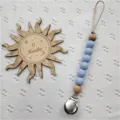 Catenella portaciuccio in silicone con perline di legno e clip in acciaio inox per neonati. - Blu a Pois