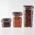 Set of 3 clear plastic square food storage containers with airtight lids for kitchen pantry organization. - 600ml / Black