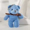 Close-up of a small blue plush teddy bear keychain pendant with a brown ribbon - 12cm / Light Blue