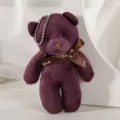 Detailed macro view of a cute purple plush teddy bear keychain with an elegant 'Love' ribbon bow. - 12cm / Purple
